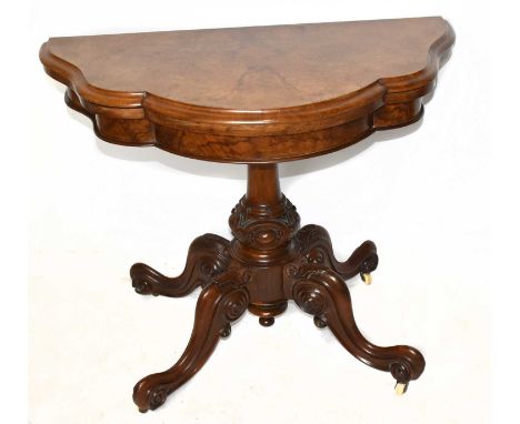 A Victorian walnut serpentine shaped card table with fold over top, width 94cm.Top with some light age wear scratches and a s