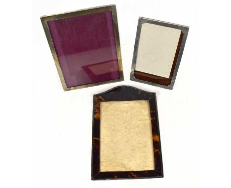 A George V hallmarked silver and tortoiseshell mounted easel back photograph frame, London 1917, 26 x 18cm, (af), together wi