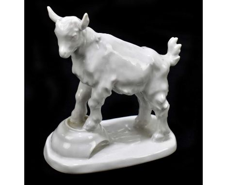 MEISSEN; a model of a lamb resting on a bowl, blue cross sword to the underside, height 14cm.Pin head nibbles to the foot rim