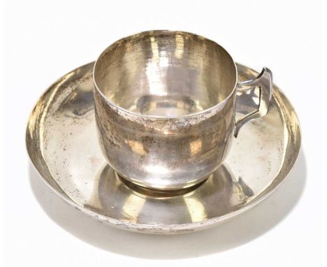 An Indian white metal tea cup and saucer with pin prick decoration, approx weight 8.06ozt/250g.This item is catalogued as whi