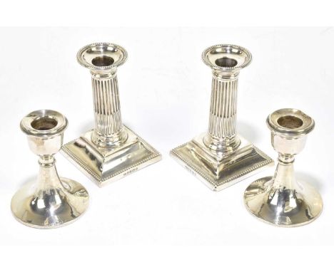 HARRISON BROS &amp; HOWSON; a pair of Victorian hallmarked silver squat Corinthian column candlesticks with cast beaded rims,