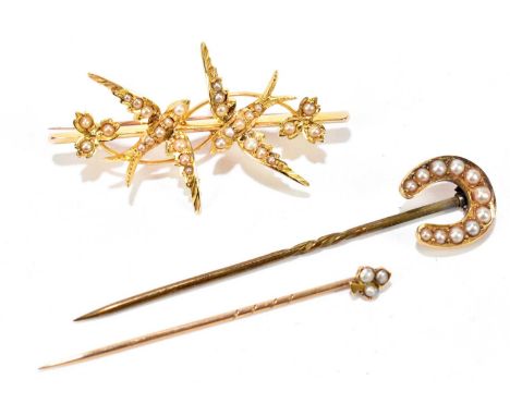 A Victorian yellow metal seed pearl bar brooch set with a pair of swallows and floral decoration, together with a yellow meta