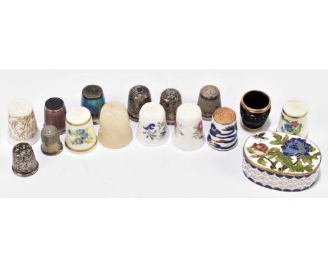 A group of thimbles including three hallmarked silver examples, two white metal enamel decorated examples, several porcelain 