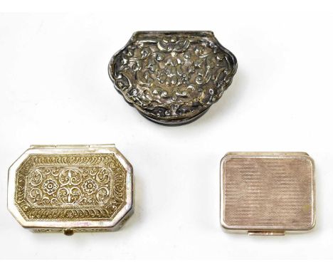 A Continental white metal snuff box of shell form with repoussé floral decoration, unmarked, together with an Eastern white m