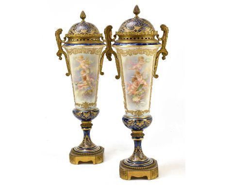 COLLOT FOR SEVRES PORCELAIN; a pair of impressive pedestal vases and covers with ormolu mounts and handles, the dome covers s