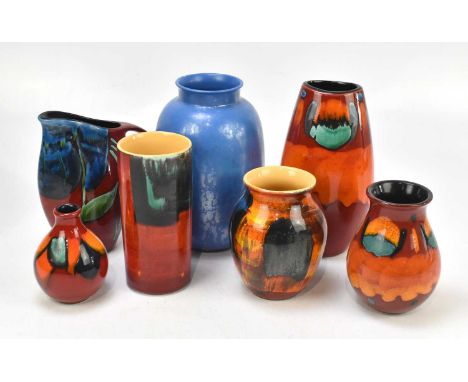 POOLE POTTERY; a group of six vases to include a mottled blue vase, height 25cm, and a Poole Pottery jug decorated with leave