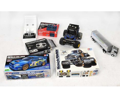 TAMIYA; a Subaru Impreza WRC 2003 radio controlled car, with a Midnight Pumpkin radio controlled buggy and a model of a lorry