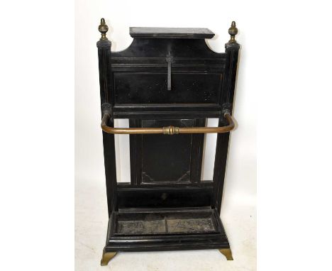 A Victorian ebonised stick stand with brass rail, width 55.5cm, height 100cm.Old worm holes to the back and the back right le