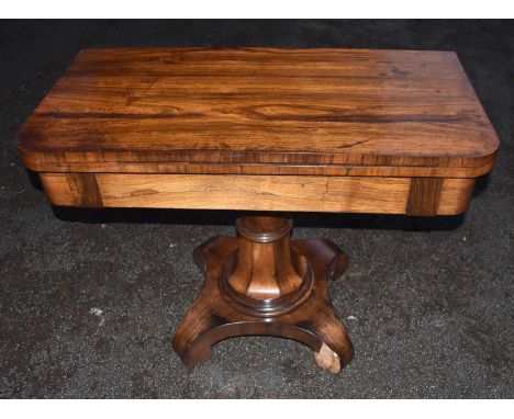 A Victorian rosewood card table, the D-shaped fold over top on pedestal and quadrapartite base, width 97cm.