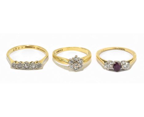 An 18ct yellow gold and platinum three stone dress ring, approx size M, together with two further 18ct yellow gold dress ring