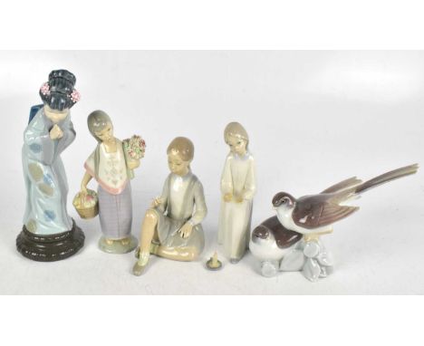 LLADRO; a collection of four ceramic figures including a geisha, tallest 26cm, with a Lladro group of two birds (5)The chambe