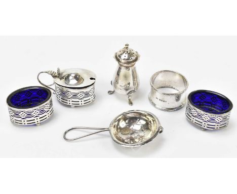 A George V hallmarked silver three piece cruet, Chester 1919, also a Sheffield hallmarked silver pepperette and napkin ring, 