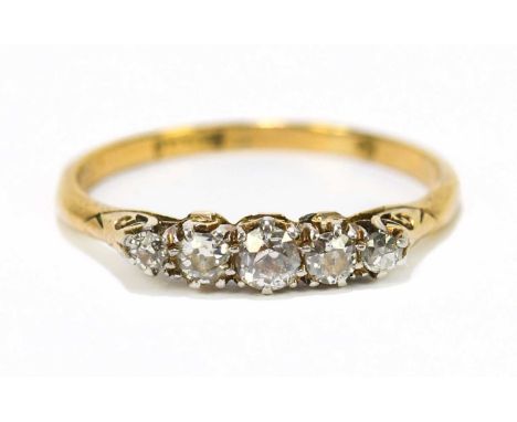 An 18ct gold diamond five stone dress ring, approx size R, approx weight 2.4g.