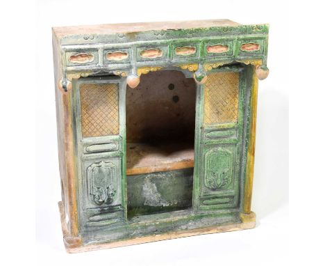 A Chinese Tang dynasty (618-906AD) Sancai glazed model of a door way with pagoda top, height 40.5cm, width 36cm.