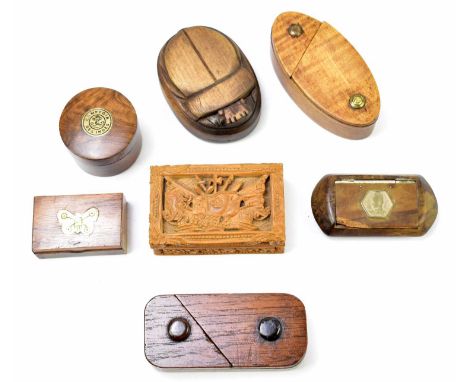 A collection of treen snuff boxes to include a French prisoner of war example with carved decoration flags and floral detail,