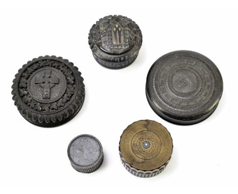 A late 19th century carved bog oak circular snuff box, the cover embossed with a Celtic cross flanked by floral detail, diame