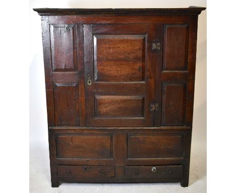 A Georgian oak livery cupboard, with panel door enclosing hooks and two drawers to base, width 132.5cm, height 156cm.Two of t