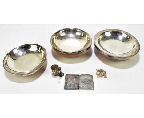 A white metal mounted graduated set of three shell bowls, diameter of largest 18cm, together with a silver plated panel after