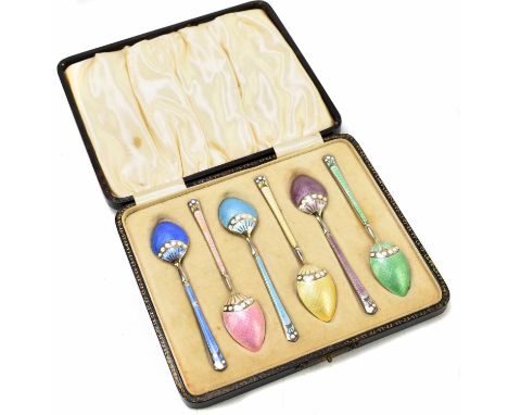 TREVITTS &amp; SONS; a cased set of six of silver and coloured enamel coffee spoons, Birmingham 1928, length 9.5cm.The dark b