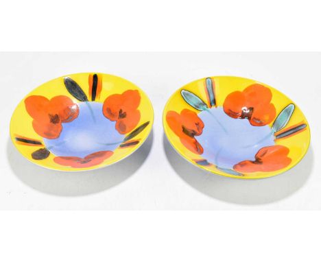 POOLE POTTERY; two large fruit bowls, decorated with stylised flowers, printed marks, diameter 34cm (2).These are modern Pool