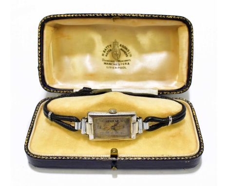 ROLEX; a lady’s 18ct white gold cased cocktail watch, the rectangular dial with engine turned decoration set with Arabic nume