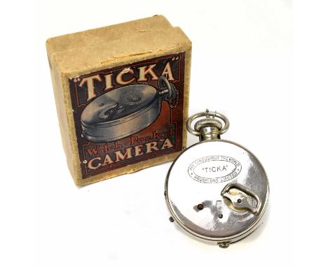TICKA; a chrome watch pocket camera, in original box with booklet and instructions.