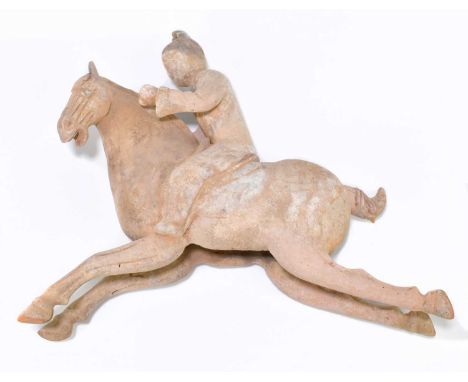 A Chinese Tang dynasty (618-906AD) model of a horse with attendant upon its back, length 32cm (af).Both front legs have been 