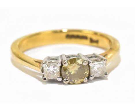 An 18ct yellow gold three stone dress ring, the central princess cut diamond approx .33ct, flanked by a pair of princess cut 