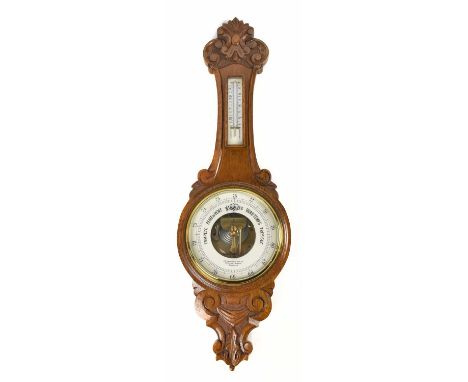 B.F AMERICAN OPTICAL COMPANY BRUSSELS; an early 20th century carved oak wheel barometer, height 88cm.