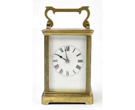 A late 19th century French brass eight day carriage clock, the enamel dial with Roman numerals, and movement striking on a go