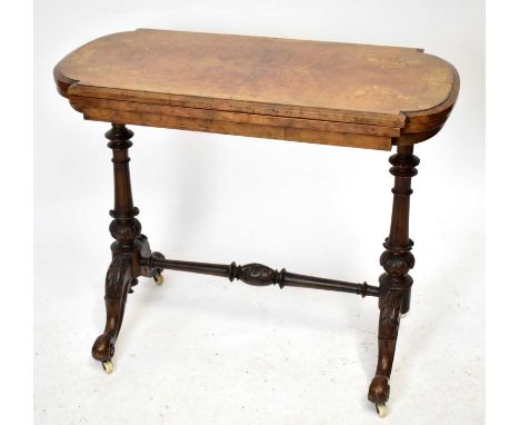 A Victorian walnut and inlaid card table, the fold over top on turned supports, width 92cm.Top with some sun fading and Gener