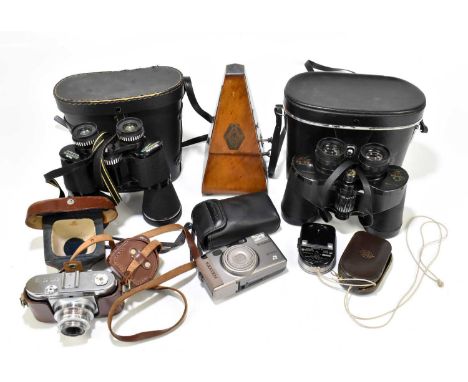 Two pairs of cased binoculars to include a pair of Greenkat de Luxe 8.5x50 Kestral examples, a metronome, a Voigtlander camer