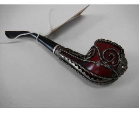 A twentieth century pipe with filigree metal work decoration 
