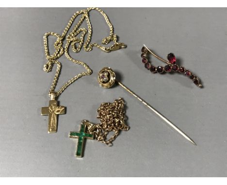 A collection of 9ct jewellery to include - a garnet brooch, green stone set crucifix and chain, Victorian stick pin, 9ct gold