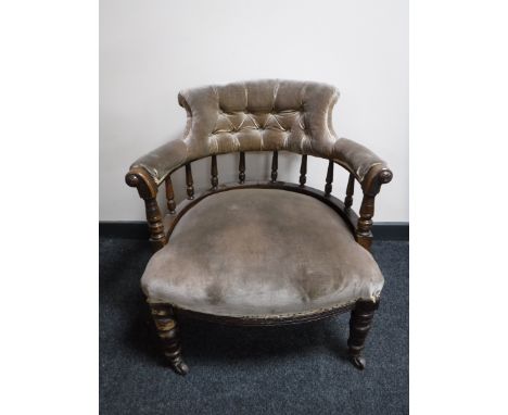 A Victorian mahogany armchair, upholstered in a button dralon fabric 