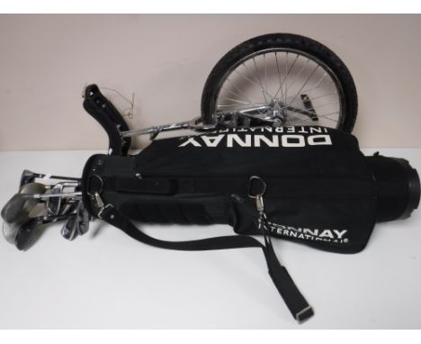 A Donnay golf bag and assorted drivers, Dunlop irons and a unicycle 