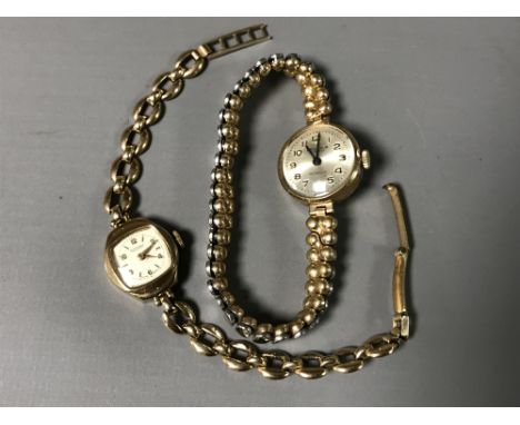 Two 9ct gold lady's watches - one on expansion bracelet and one by Rotary with metal core integral bracelet. (2)