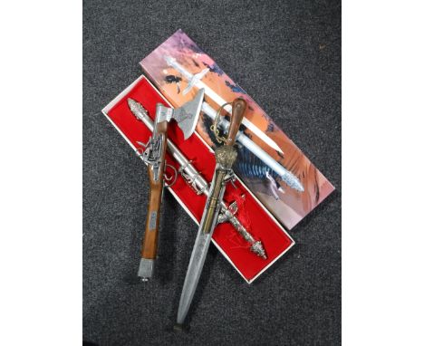 A boxed German fantasy knife, together with a fantasy sword-pistol and axe-pistol