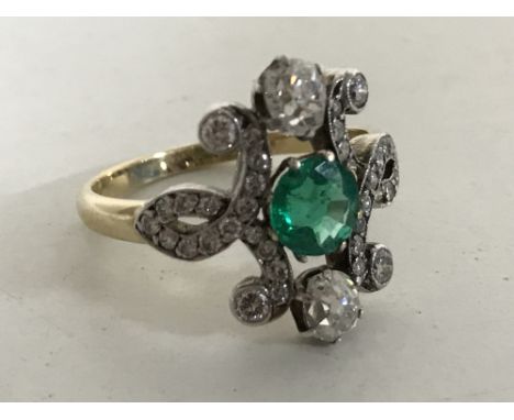 An 18ct gold emerald and diamond Art Nouveau style ring, size M/N. CONDITION REPORT: The ring is in good condition. It weighs