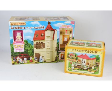 A quantity of Sylvanian Families vintage toys including ; a family house, Village sweet shop, Wash day set, Sweet Dreams bed,