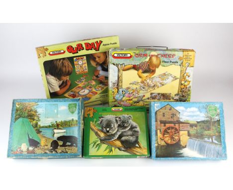 A large quantity of vintage wooden jigsaw puzzles, mainly Victory including ; Helpful People series, Traction Engine series, 