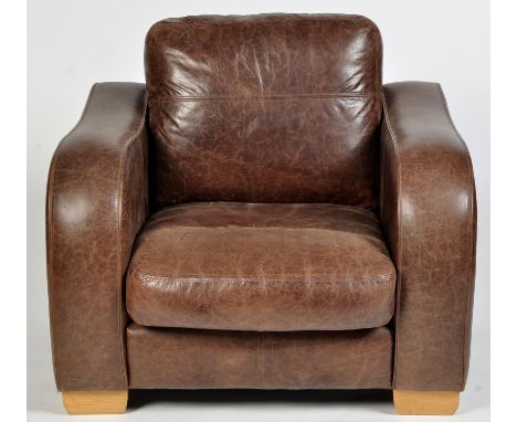 Siren Furniture Ltd: a brown leather armchair, on light wood feet, 97 x 90 x 75cms high.