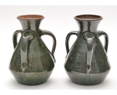Burmantoft: two Art Nouveau style three-handled vases with green glaze, inscribed 'Barrow'? and initials EP to bases, 16.5cms