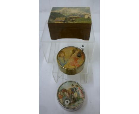 Two French crank wind circular musical boxes, metal cased, with printed card tops and inscribed paper bases, 2 3/4" diameter,