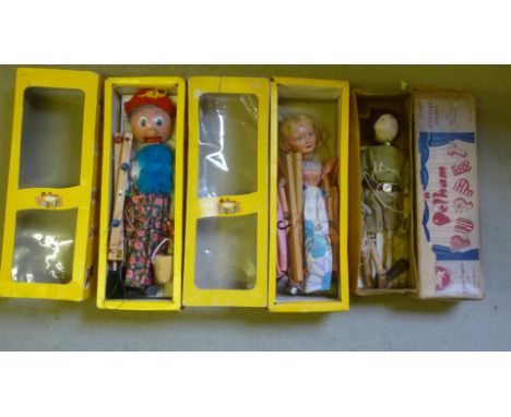 Two Pelham puppets "Old Lady" and "Cinderella", in yellow window boxes, and a Pelham kit puppet in buff box with maroon/blue 