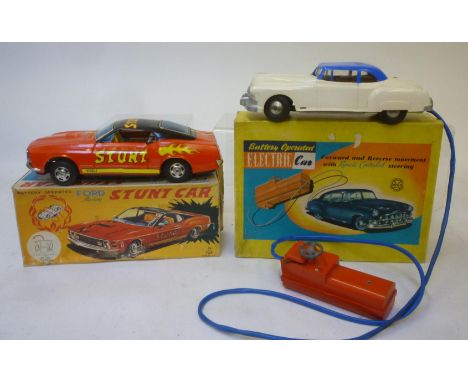 Eight tinplate vehicles comprising Japanese Ford Mustang stunt car, battery powered, 10 1/2" long, boxed, Marx battery operat