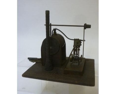 Small vertical single cylinder non-reversing steam engine and boiler fixed to wooden base, gas fired boiler, small drive shaf