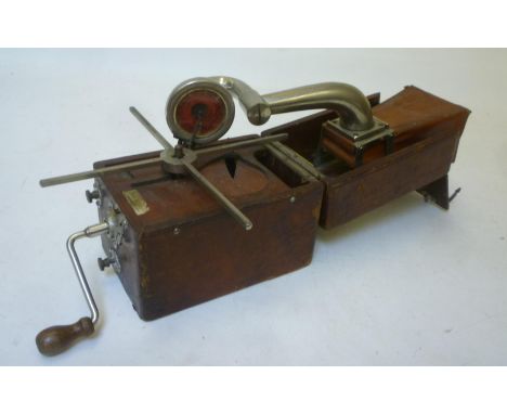 A Peter Pan "Camera" gramophone with folding brown leather covered wood case, and speaker horn, nickel plated interior fittin