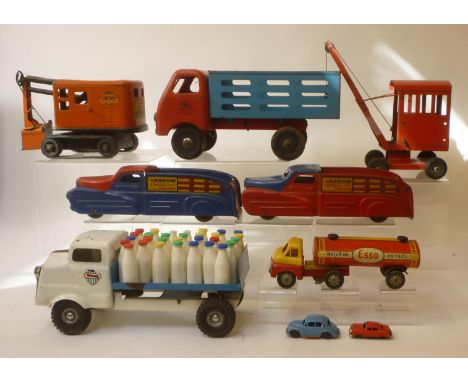 Three Triang tinplate toys comprising milk lorry, tipper lorry and mobile crane, a Marklin tinplate excavator on caterpillar 