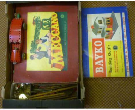 A Meccano Outfit No 5 with green and red parts and instruction book, box AF, a Bayko Building Set No 13 with instruction book
